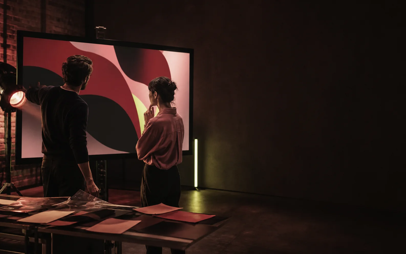 Creative team reviewing an abstract campaign in an editing studio